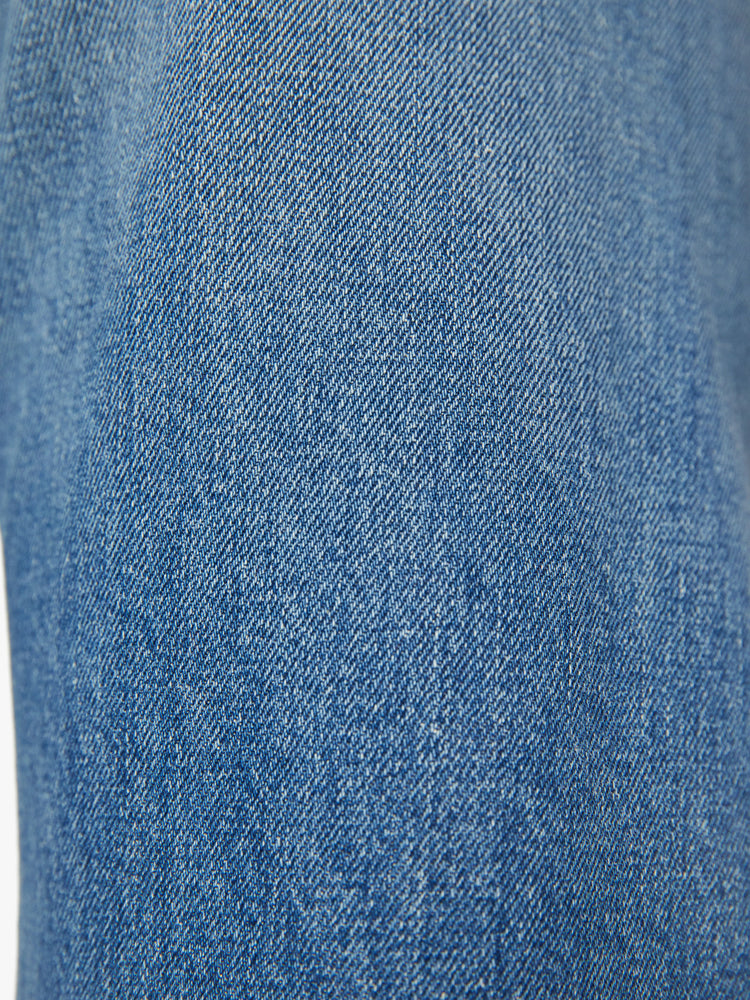 Swatch view of a woman super wide-leg jeans with a high rise and a long 32-inch inseam in a mid blue wash.