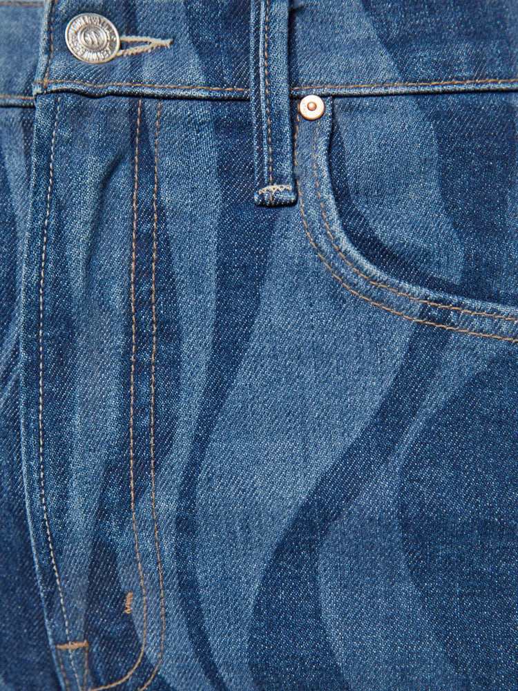 Swatch view of a woman in a dark blue with a laser-printed abstract stripe pattern wide-leg pants with a zip fly, high rise and a 32-inch inseam with a clean hem. 