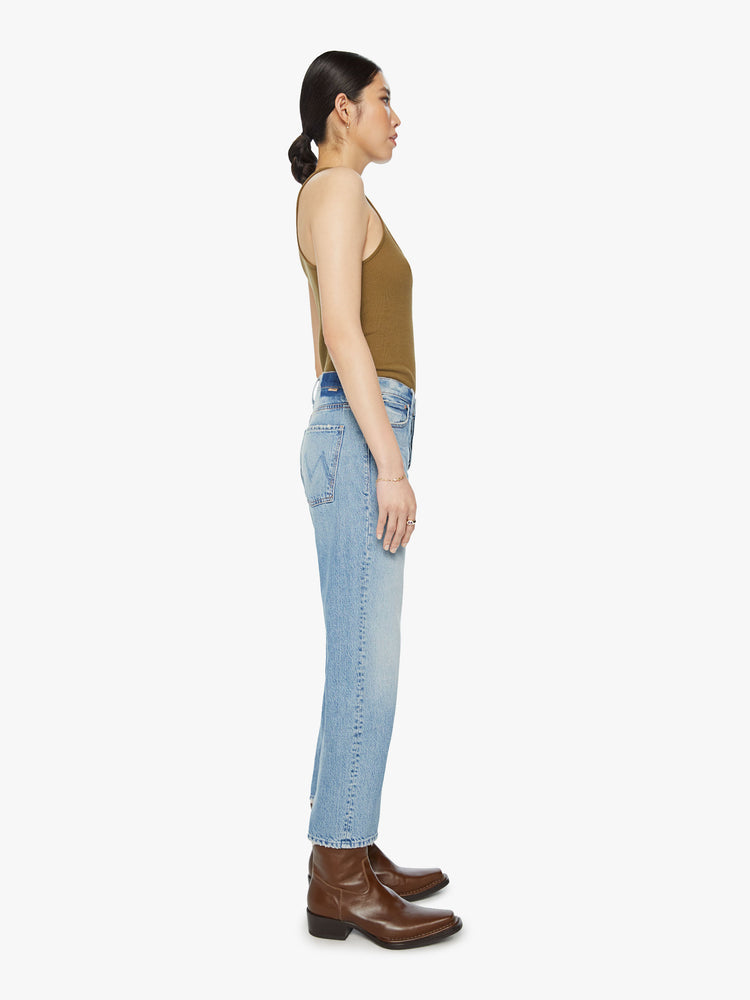 Side view of a woman Cropped jeans with a button fly, slouchy straight leg, 26-inch inseam and relaxed fit in a light blue wash.