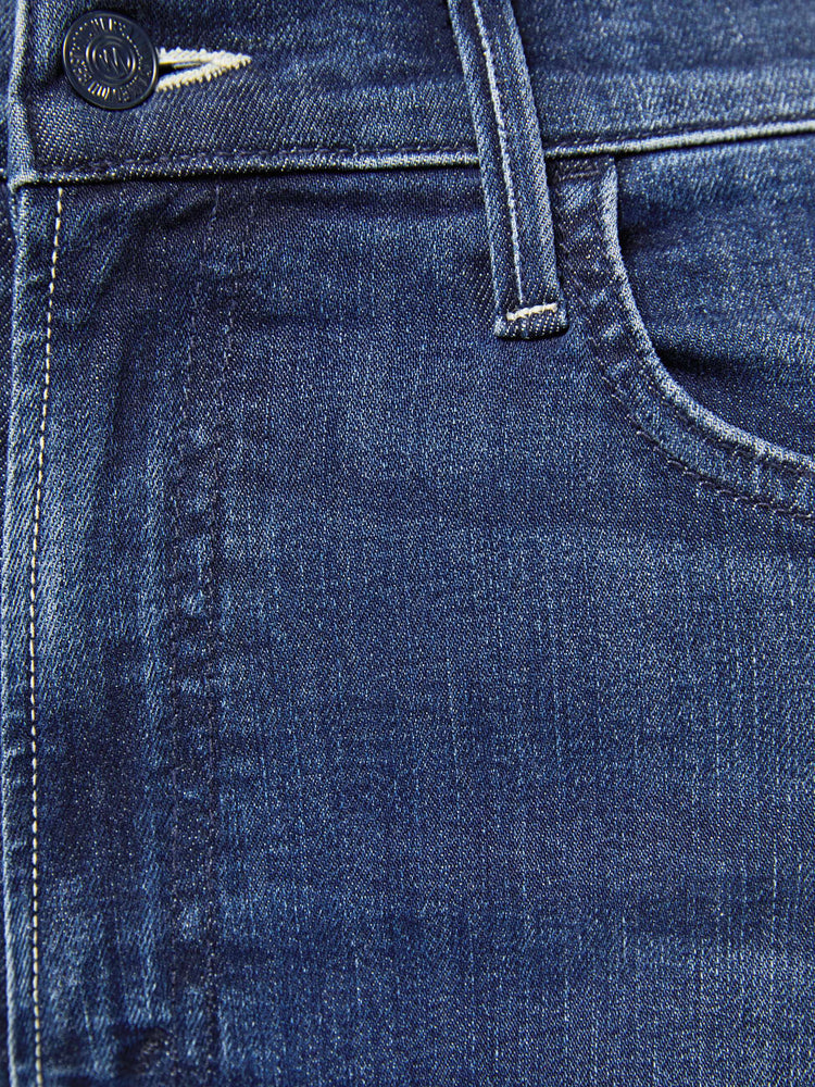 Swatch detail view of a dark blue denim wash jean.