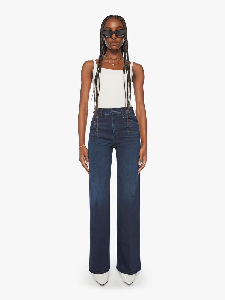 Front view of a woman dark blue wide leg jeans with a high rise, 34-inch inseam and a clean hem.