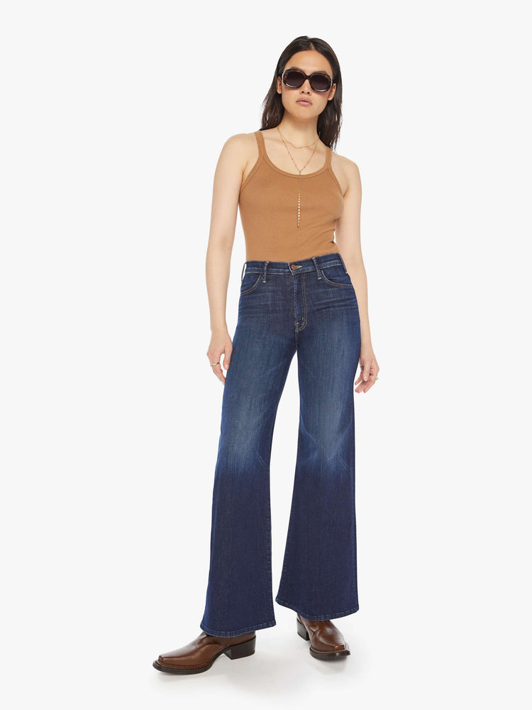 Front view of a woman dark blue wide leg jeans with a high rise, 32-inch inseam and a clean hem. 