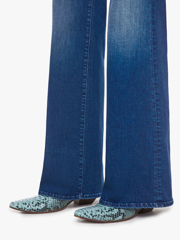 Hem view of a woman in a wide leg jeans with a high rise, zip fly, 33.25-inch inseam and a clean hem.