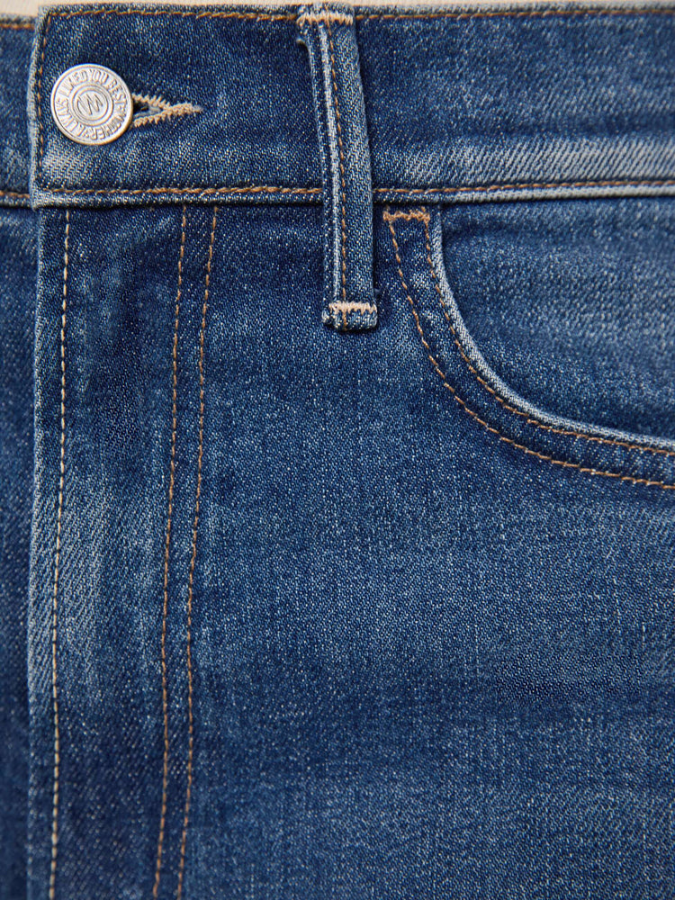 Swatch view of a woman in a mid blue wide leg jeans with a high rise, 33 7/8 inch inseam and a clean hem. 