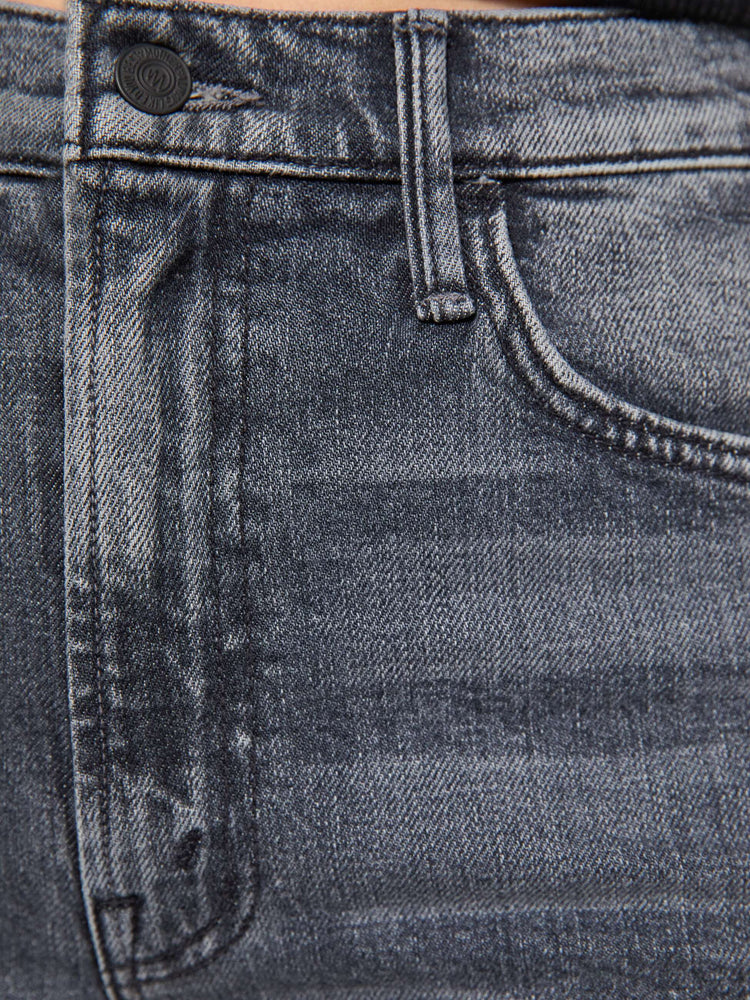Swatch view of a woman in faded grey wide leg jeans with a high rise, zip fly, 32-inch inseam and a clean hem.