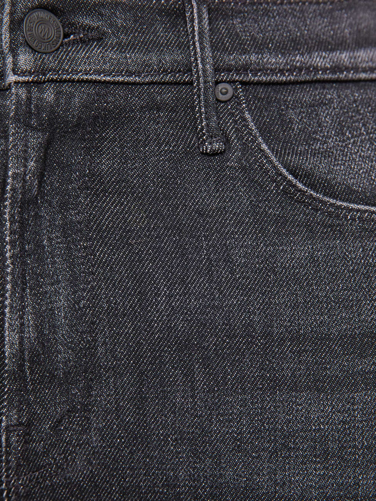 Swatch view of a woman in washed black  mid-rise straight leg with a zip fly, 28.25-inch inseam and a clean hem. 