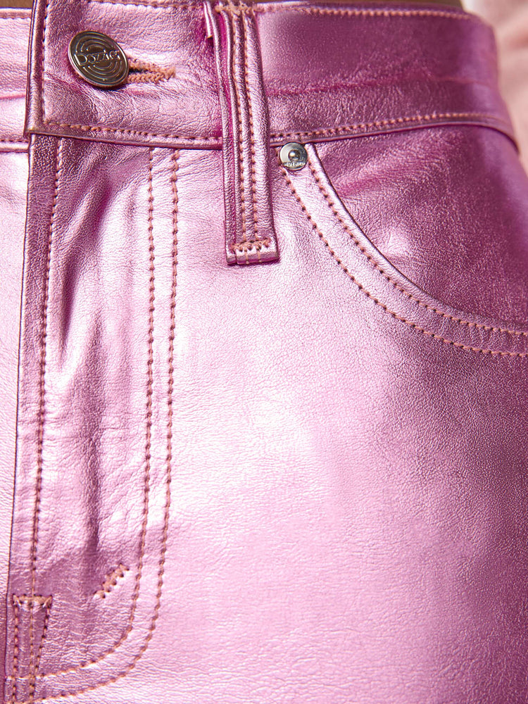 Swatch view of a woman in mid-rise straight leg has a zip fly and a 28.25-inch inseam with a clean hem in a metallic faux leather, Hoop Earrings is a reflective light pink.