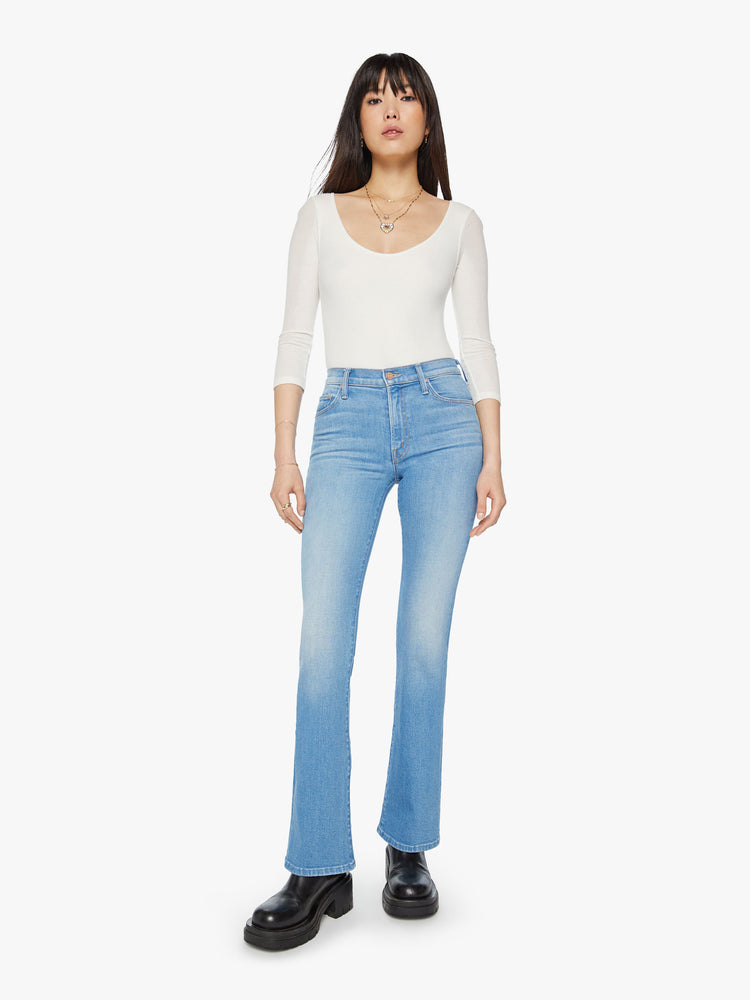 Front view of a narrow flare jeans with a mid rise and a long 32-inch inseam with a clean hem in a light blue wash.