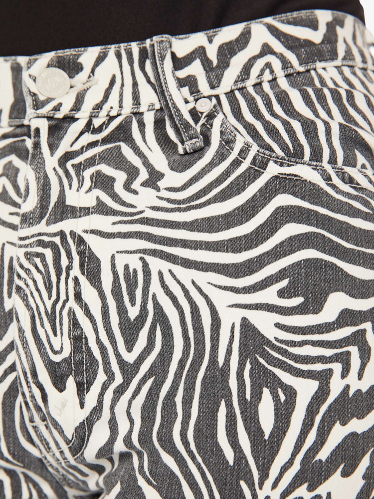 Swatch view of a woman high-rise straight leg with an ankle-length inseam and a frayed hem in a black and white graphic zebra print.