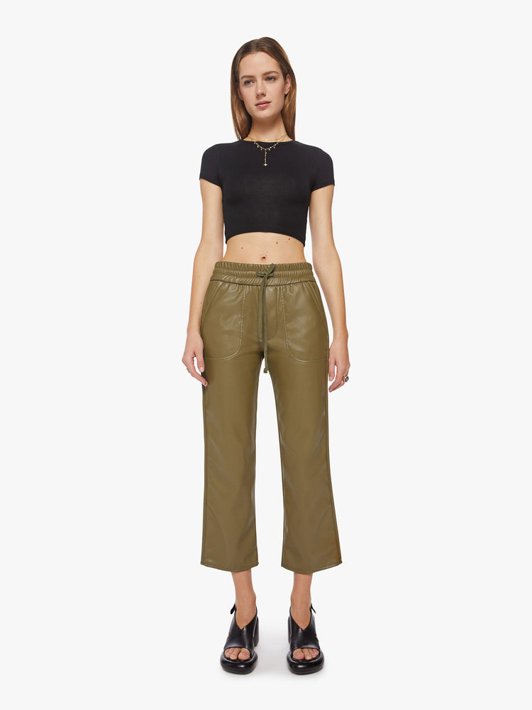 Front view of a woman high-waisted pants with a wide straight leg, elastic drawstring waistband, patch pockets and an ankle-length inseam in a fir green faux leather.