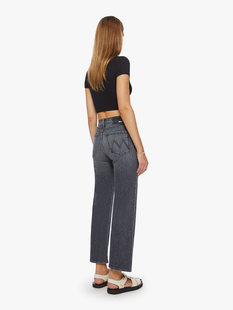 Back view of a woman high-waisted jeans with a wide straight leg, zip fly and clean 28 1/4-inch inseam in a dark grey hue.