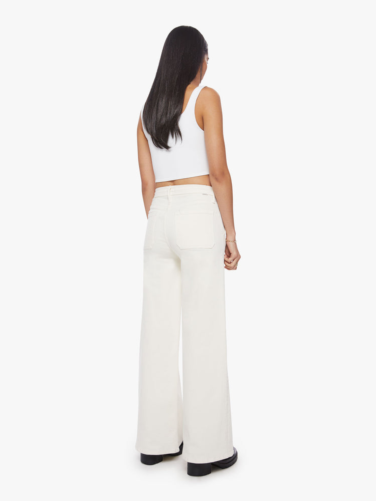 Back view of a woman wide-leg pant with a high rise, drawstring waistband and a 32-inch inseam with a clean hem in an off-white hue.