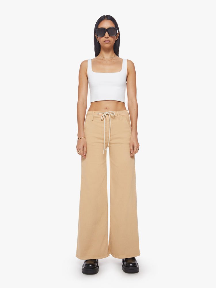 Front view of a woman wide-leg pant with a high rise, drawstring waistband and a 32-inch inseam with a clean hem in a sandy hue.