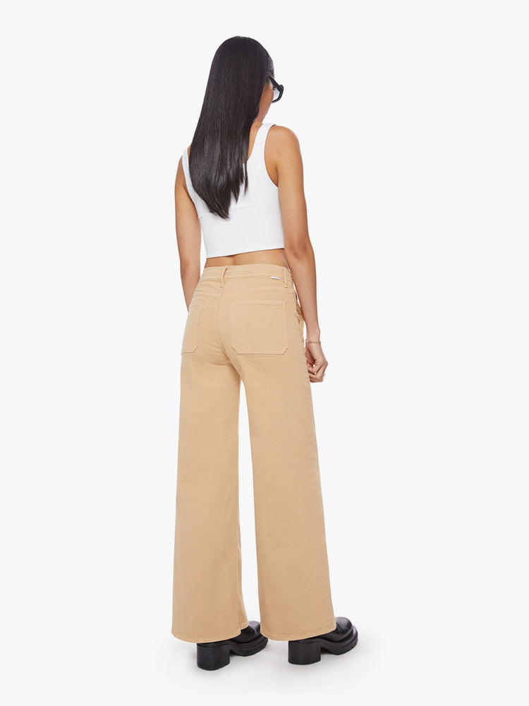 Back view of a woman wide-leg pant with a high rise, drawstring waistband and a 32-inch inseam with a clean hem in a sandy hue.