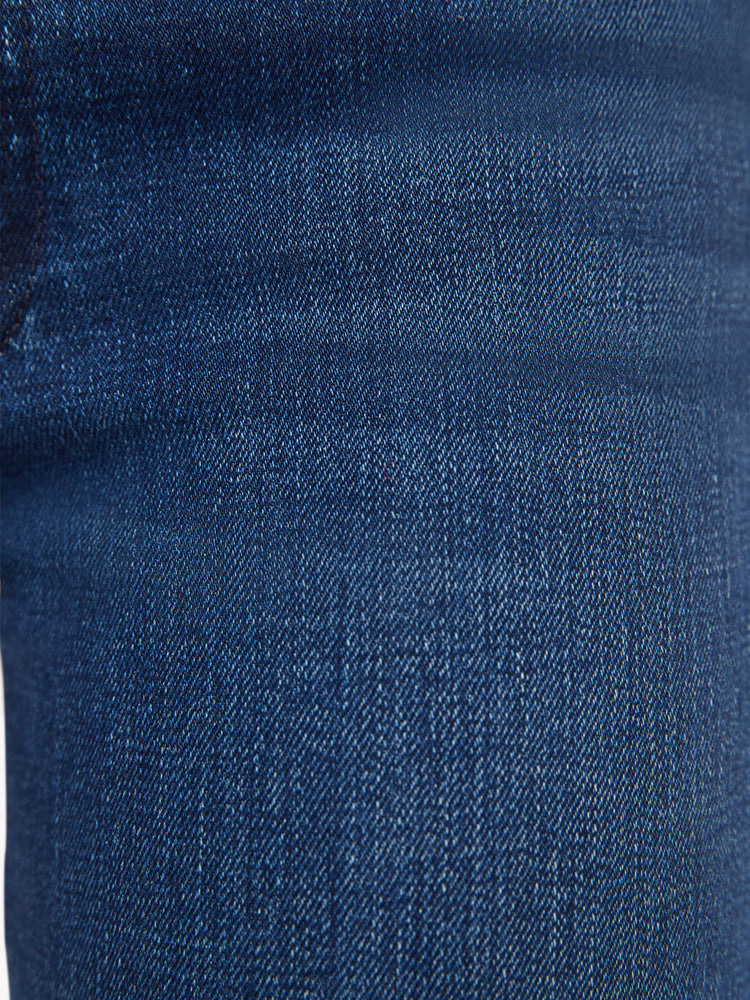 Swatch view of a woman high-rise straight leg with a 31-inch inseam and a frayed hem in a dark blue wash.