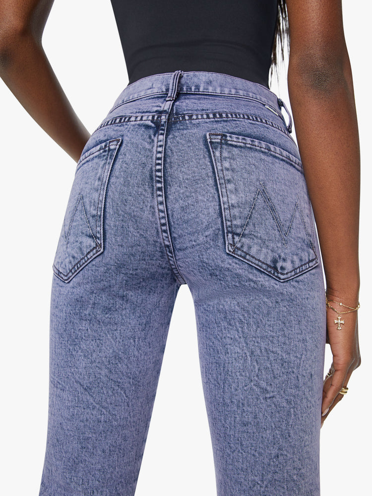 Close up back view of a woman high-rise flare with a long 34-inch inseam and a clean hem in purple.