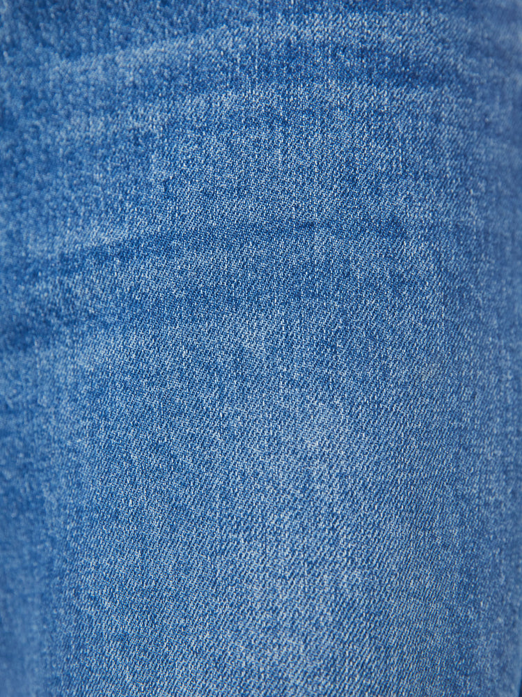Swatch view of a woman wide leg jean with a zip fly, low-set back pockets, high-rise with a slouchy fit and a 32-inch inseam in mid blue wash.