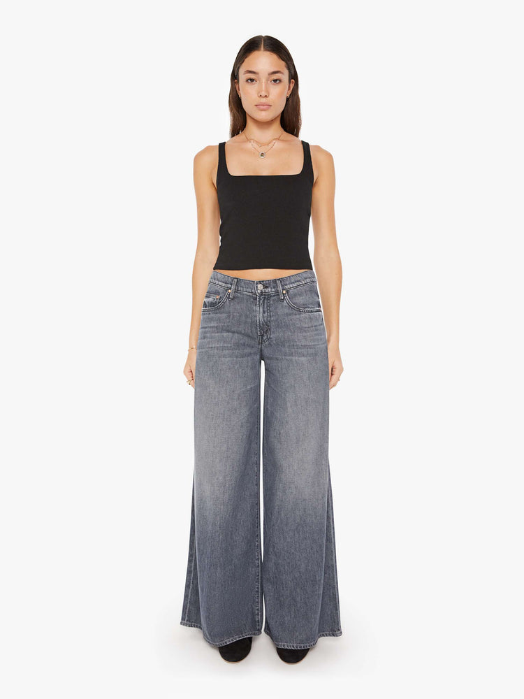 Front view of a womens grey wash jean featuring a high rise and a wide leg.