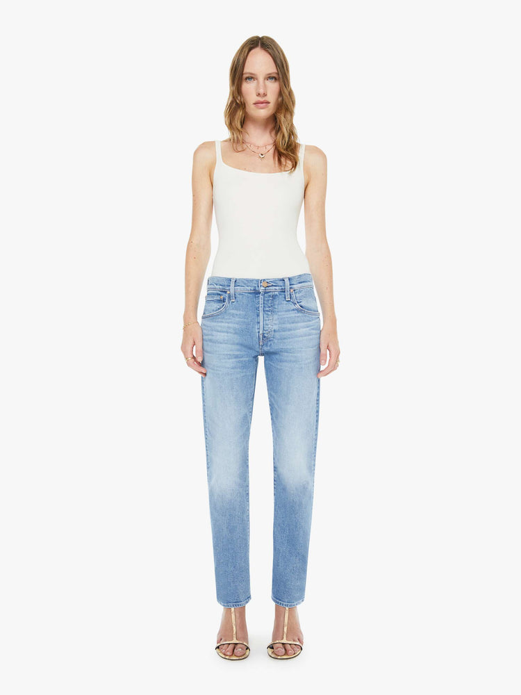 Front view of a woman in a light blue slim straight-leg was adopted from our men’s line and features a mid rise, button fly, low-set back pockets, a 29-inch inseam and a clean hem.