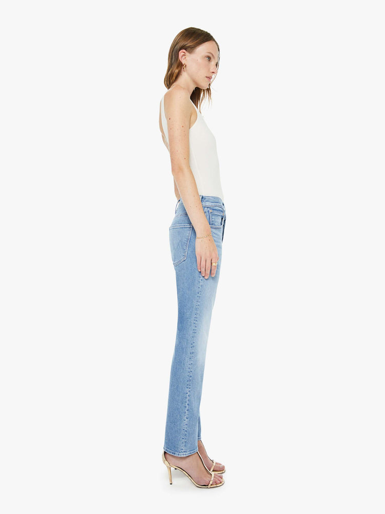 ide view of a woman in a light blue slim straight-leg was adopted from our men’s line and features a mid rise, button fly, low-set back pockets, a 29-inch inseam and a clean hem.