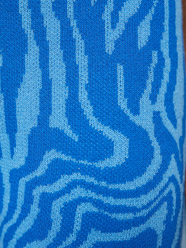 Swatch view of a woman high-waisted wide-leg flare with an elastic waist and a 31-inch inseam in blue zebra print.
