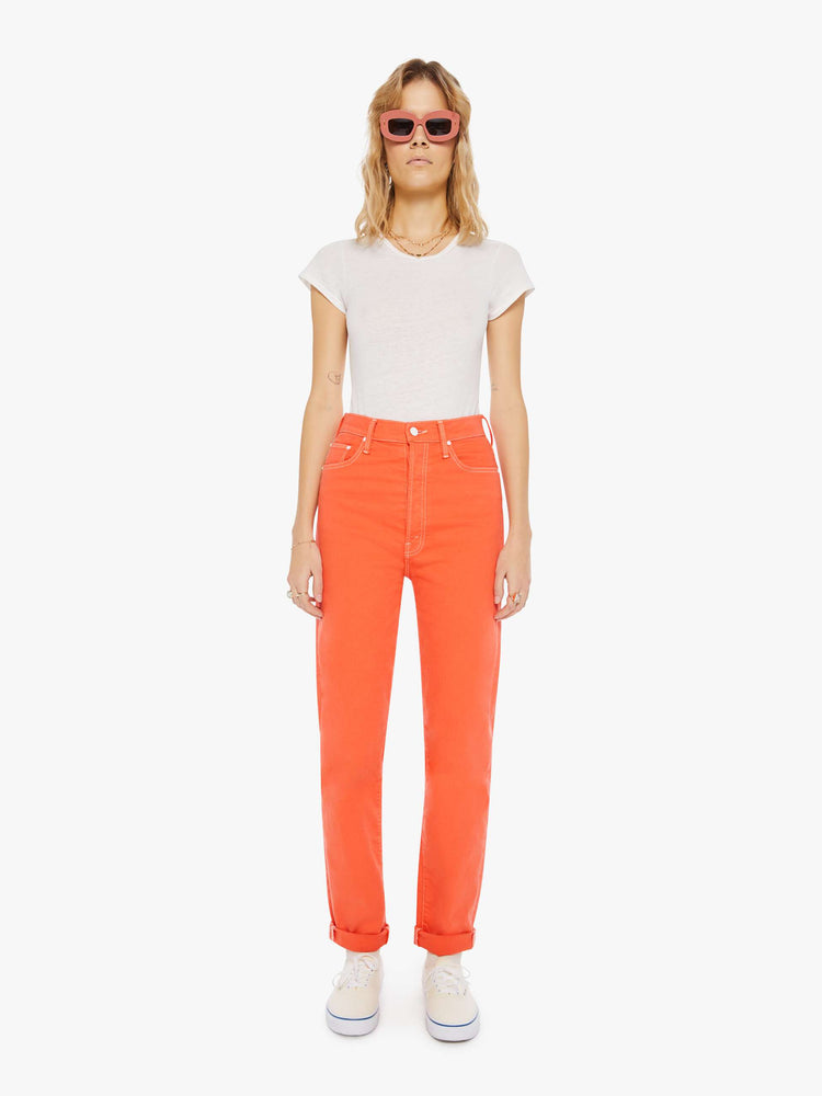 Front view of a womens bright coral jean featuring a super high rise and rolled cuff.
