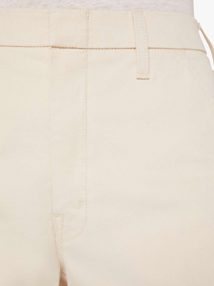 Close up swatch detail view of an ecru pant.