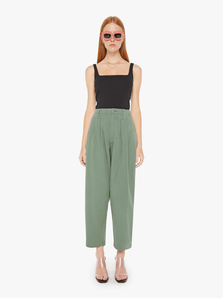 Front view of an army green pant featuring a super high rise with pleats, a wide leg, and a slightly tapered flood length hem.