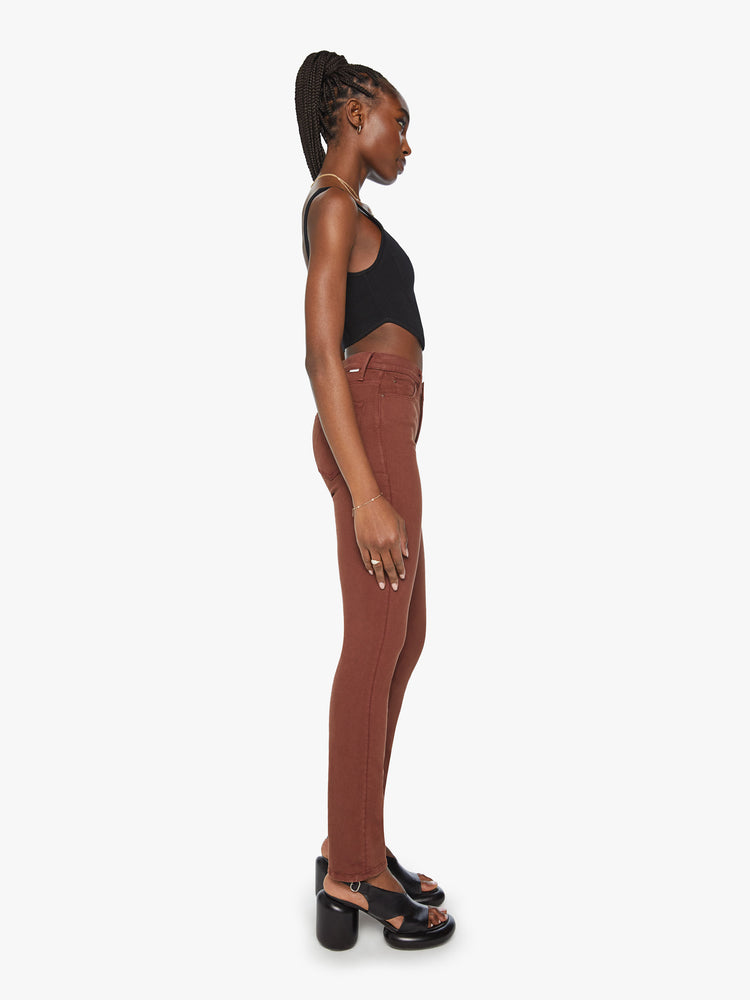 Side view of a woman mid-rise straight leg with a 31-inch inseam and a clean hem in a chocolate brown hue.
