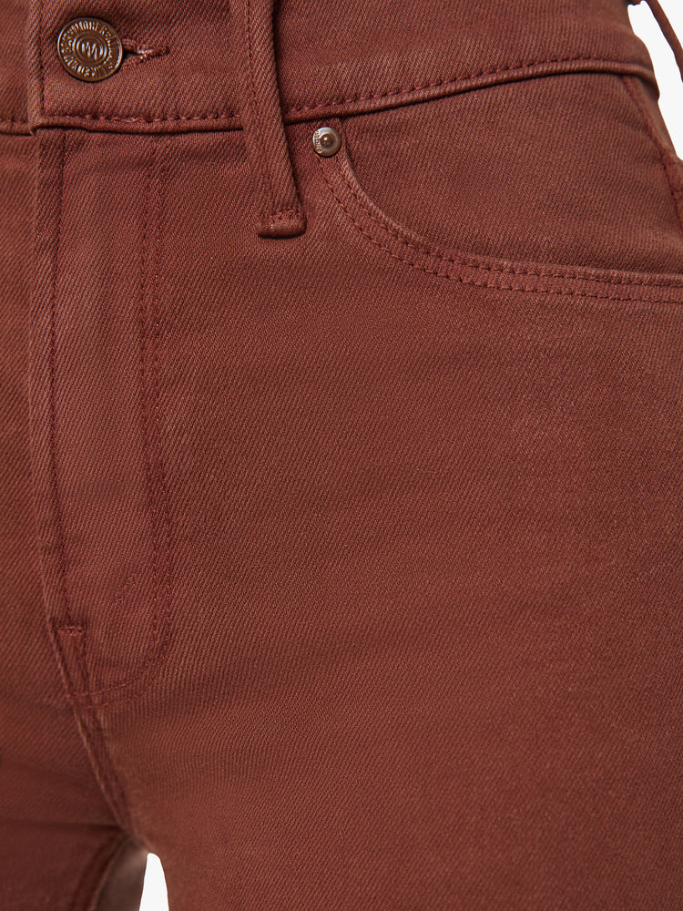 Close up view of a woman mid-rise straight leg with a 31-inch inseam and a clean hem in a chocolate brown hue.