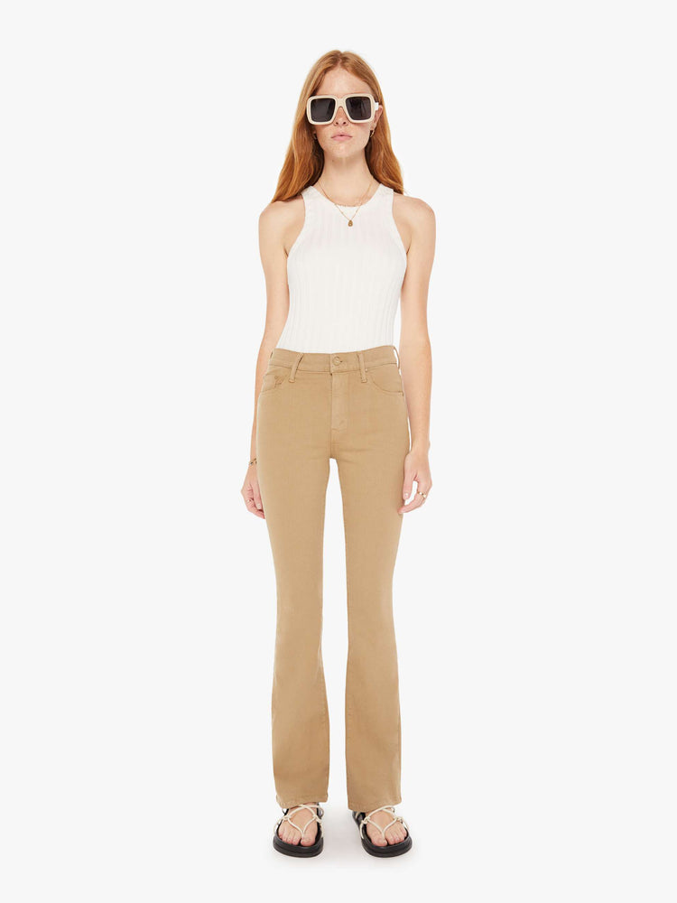 Front view of a womens brown pant featuring a mid rise and long flare leg,