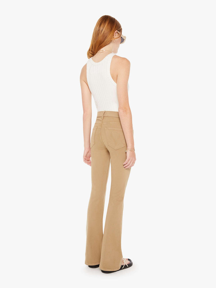 Back view of a womens brown pant featuring a mid rise and long flare leg,
