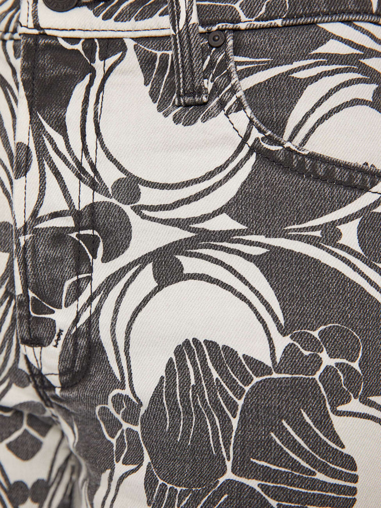 Swatch view of a woman in a faded black and cream oversized graphic print mid-rise pants with a wide straight leg, zip fly and clean ankle-length inseam. 