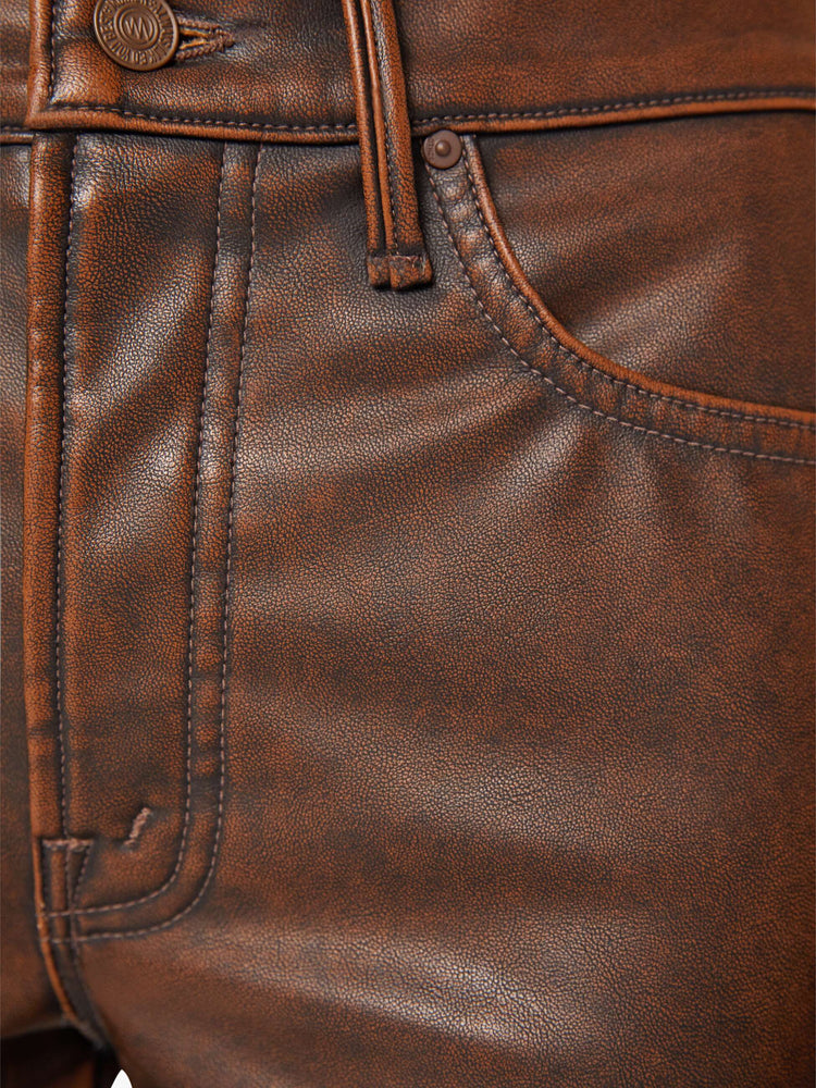 Swatch view of a woman in a faux dark chocolate brown high waisted bootcut with a 32-inch inseam and a clean hem.