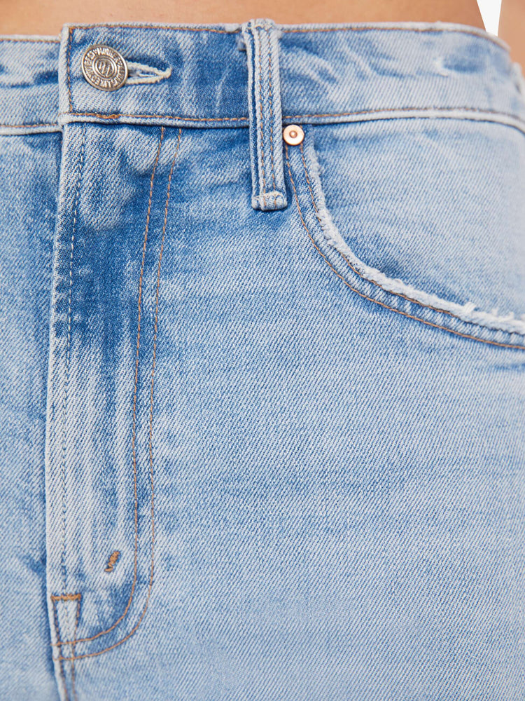 Swatch view of a woman super high-rise jeans with a flared leg, an ankle-length inseam, a slightly dropped crotch and a slouchier fit designed to sit lower on the hips in a light blue wash.