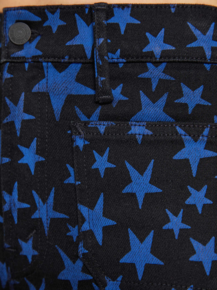Swatch view of a woman in true black and navy stars  high-waisted bootcut has a zip fly, patch pockets, a 32-inch inseam and a clean hem. 