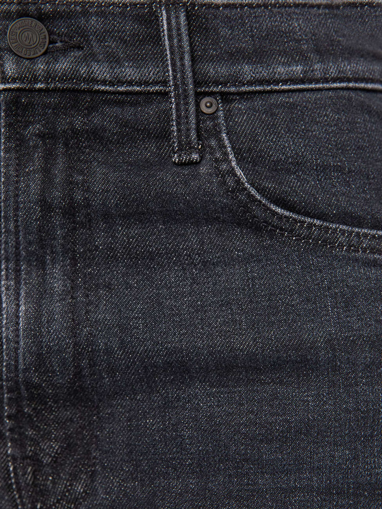 Swatch view of a woman in a washed black high-rise jeans with a straight leg, zip fly and a 32-inch inseam with a clean hem.