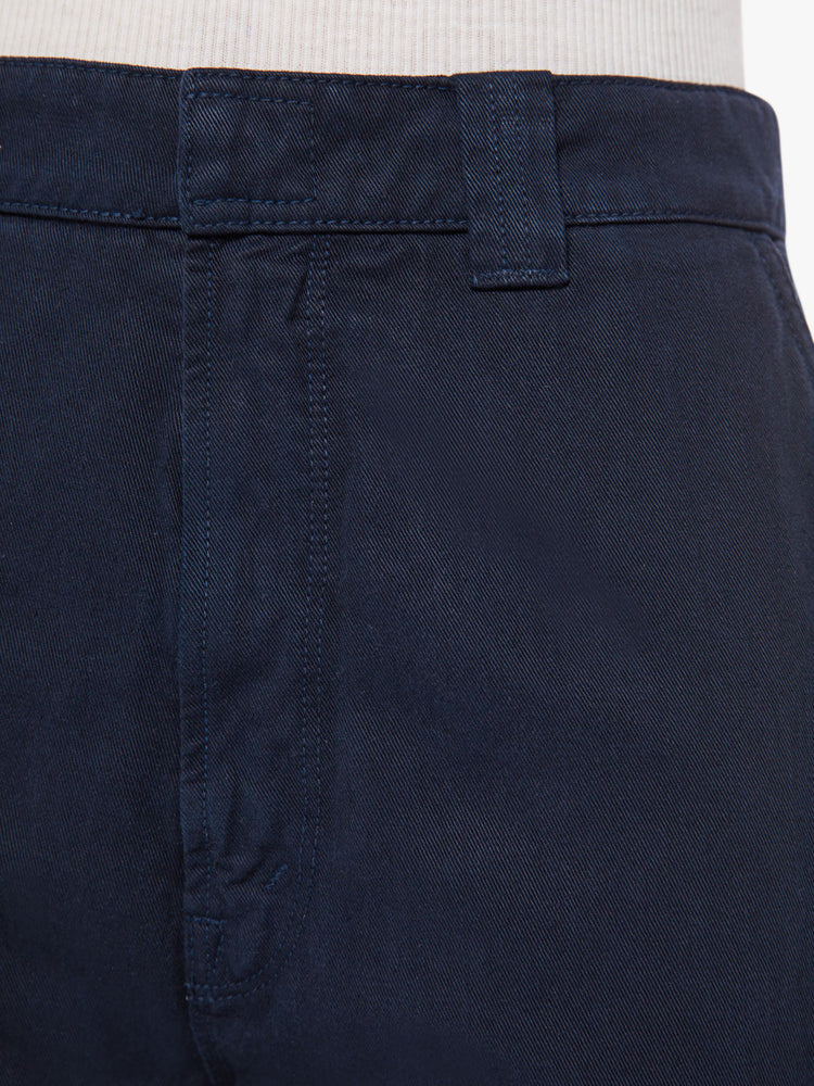 Swatch view of a woman navy trouser borrowed from MOTHER's men's collection with a high rise, tapered leg, slash pockets and an ankle-length inseam.