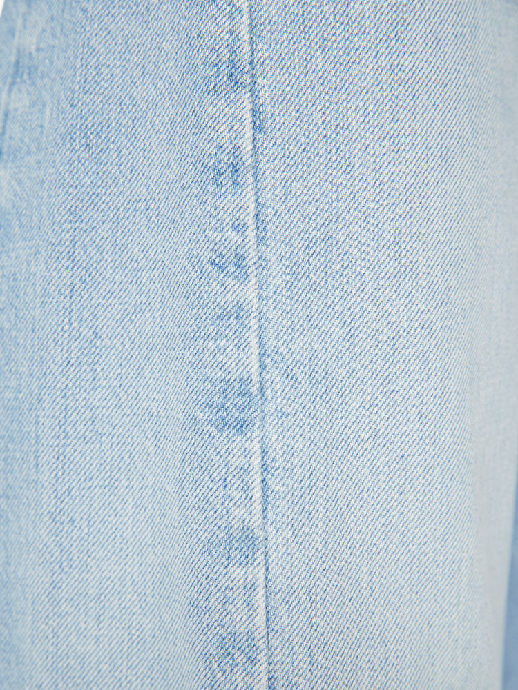 Swatch view of a woman super high-waisted jean with a wide, curved leg, an ankle-length inseam and a clean hem in a light blue wash.