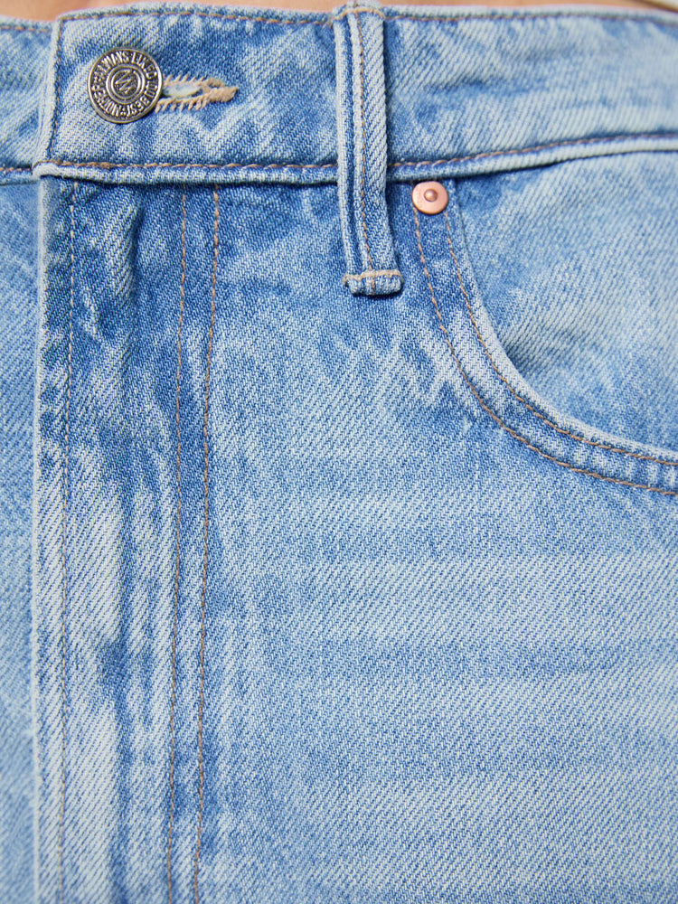 Swatch view of a a light blue wash jean with contrast brown thread.