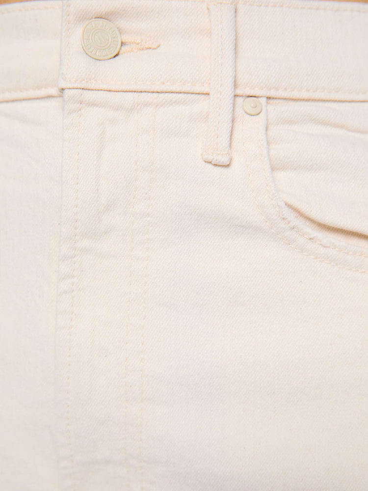 Swatch view of a woman in a cream white pant with super high-waisted jean with a wide, curved leg, an ankle-length inseam and a clean hem.