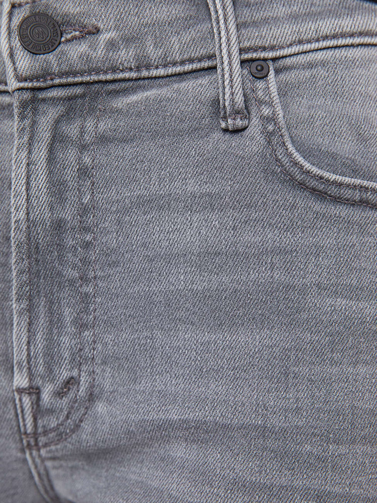 Swatch view of a woman in a light grey mid-rise straight leg with a zip fly, 29-inch inseam and a clean hem.
