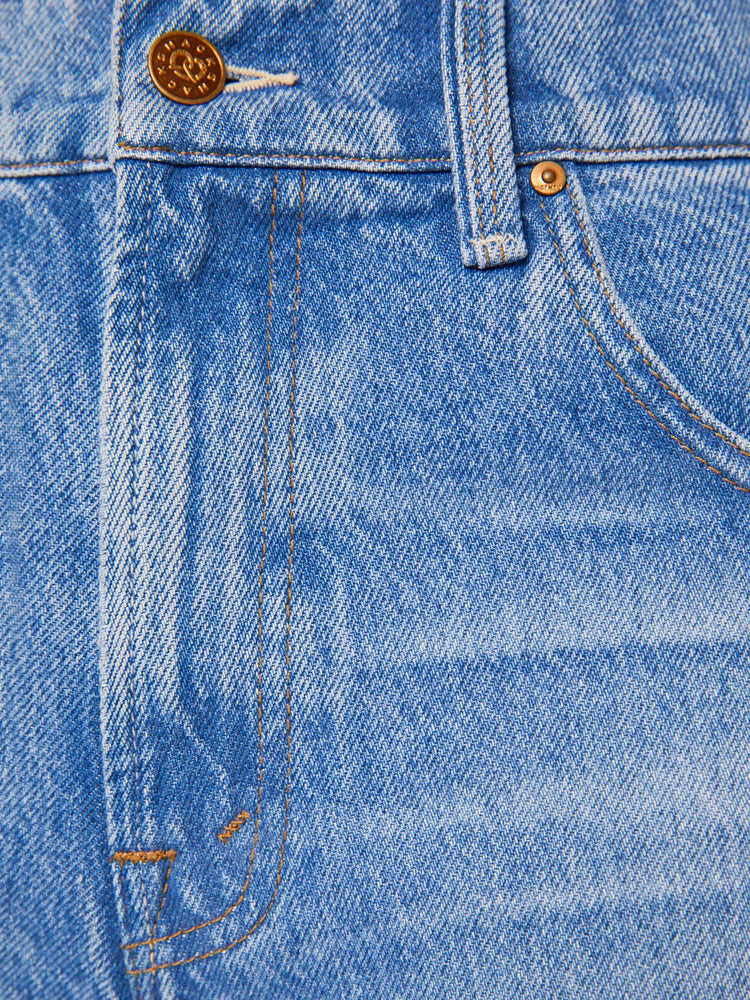 Swatch view of a woman in a mid blue high-waisted jeans have a wide leg, zip fly, cargo-inspired patch pockets, a long 31-inch inseam and a clean hem.