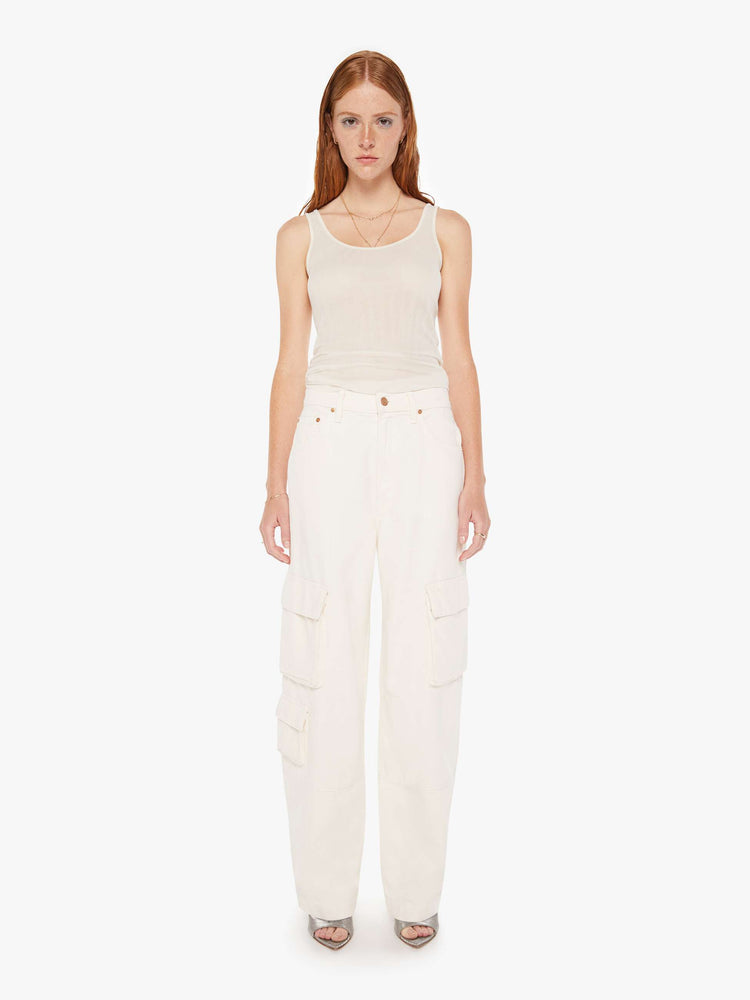 Front view of a womens off white cargo jean featuring a relaxed mid rise, cargo pockets, and a clean hem.