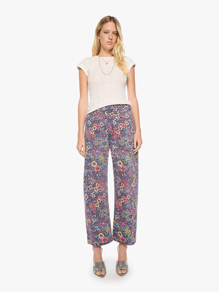 Front view of a woman in floral print super high-waisted pant with a wide, curved leg, zip fly, 28.25-inch inseam and a clean hem.