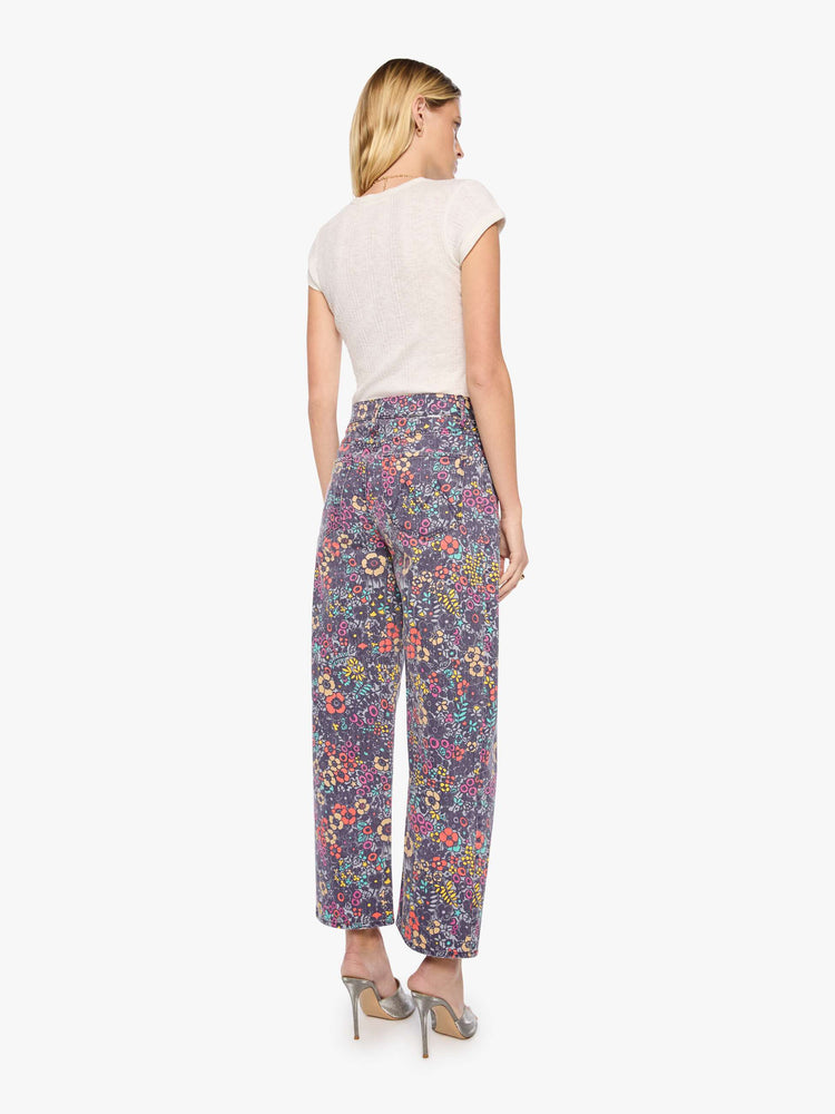 Back view of a woman in floral print super high-waisted pant with a wide, curved leg, zip fly, 28.25-inch inseam and a clean hem.
