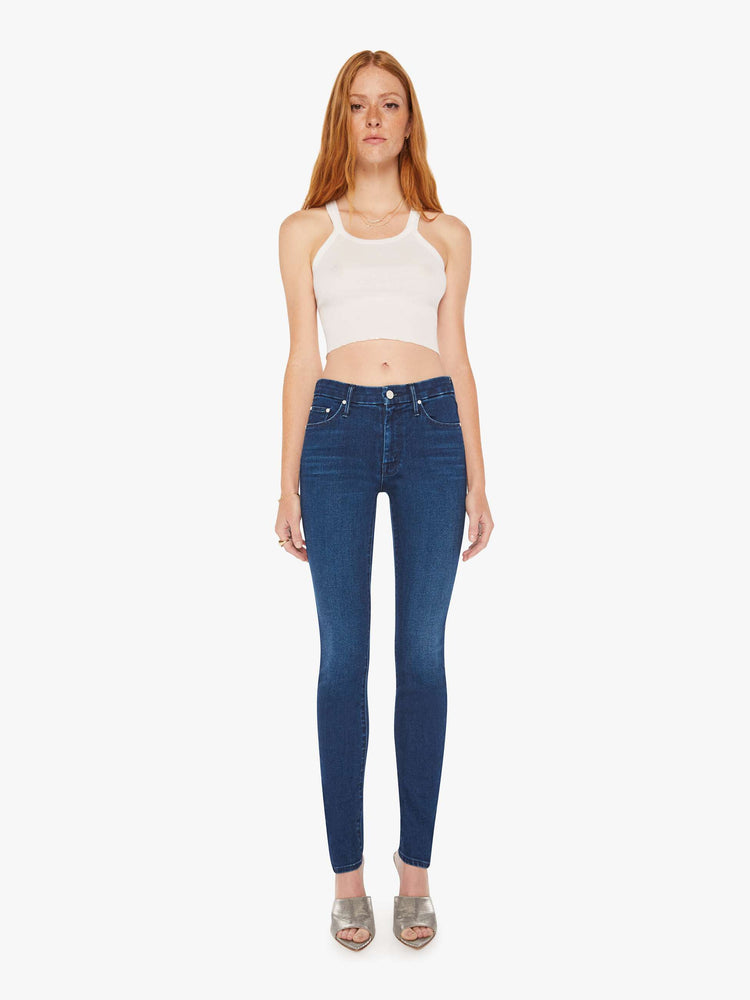 Front view of a woman cult-favorite skinny with a mid rise and a 31-inch inseam with a clean hem in a dark blue wash.