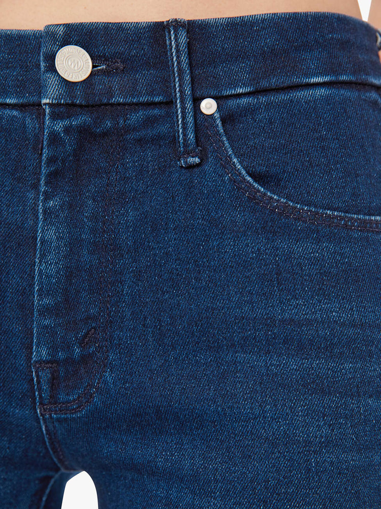 Swatch view of a woman cult-favorite skinny with a mid rise and a 31-inch inseam with a clean hem in a dark blue wash.