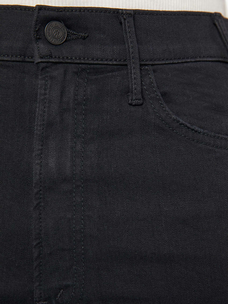 Close up view of a black jean.