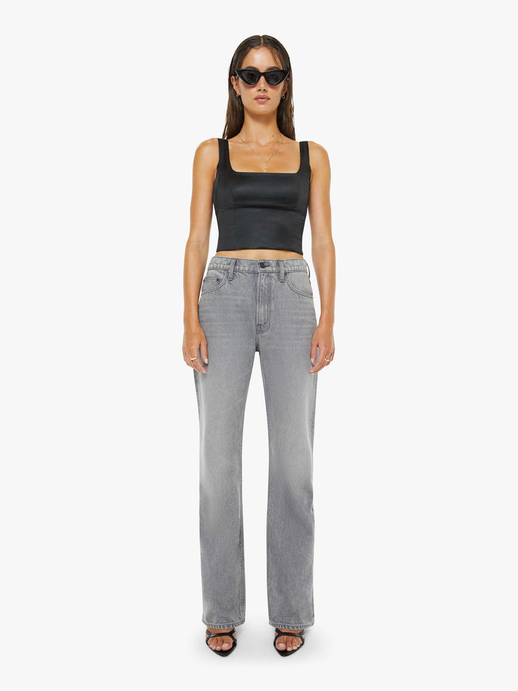 Front view of a woman in a grey low-slung jeans feature a zip fly, long 33-inch inseam with a loose leg and slouchy fit.
